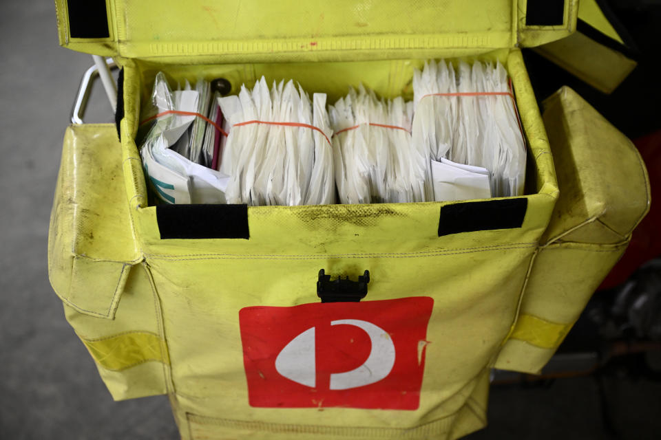 A general view of mail loaded into a motorbike prior to delivery at the Australia Post Nepean facility in Sydney.