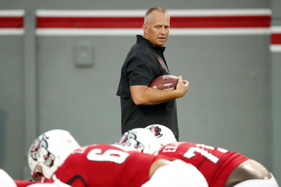 North Carolina State head coach Dave Doeren surveys his team prior to an NCAA college football game against Furman in Raleigh, N.C., Saturday, Sept. 18, 2021. (AP Photo/Karl B DeBlaker)