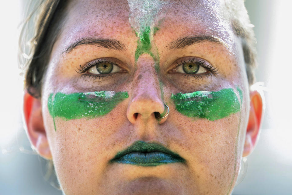 Abby Thomas, 27, of Los Angeles, poses for a portrait while protesting outside the Supreme Court about abortion, Wednesday, June 15, 2022, in Washington. "If it is overturned, the majority of the country supports abortion access," she said, "and I hope the majority of the country would come out, to show the Supreme Court and the Republican party the extent they've wronged the American people." (AP Photo/Jacquelyn Martin)