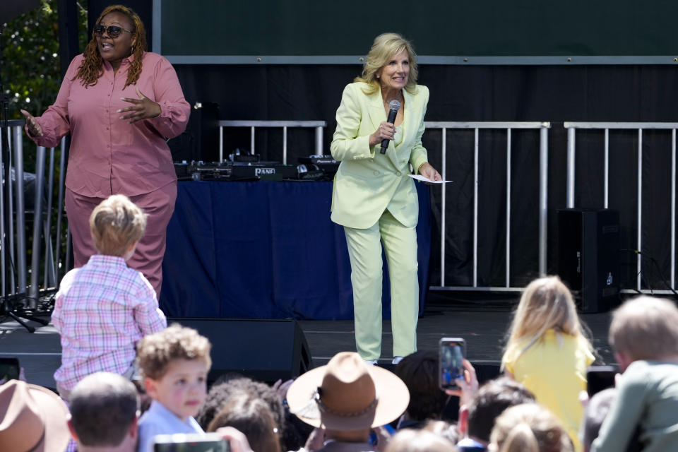 Jill Biden stands on stage as she speaks to the audience during the 2023 White House Easter Egg Roll, Monday, April 10, 2023, in Washington. (AP Photo/Susan Walsh)