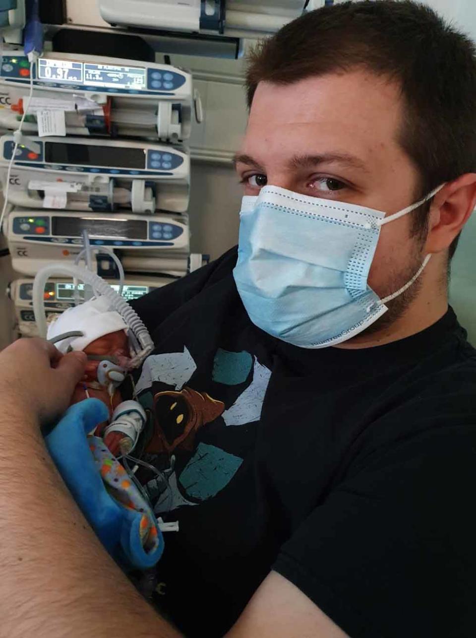 Edward holding Oscar for the first time in hospital (Collect/PA Real Life).