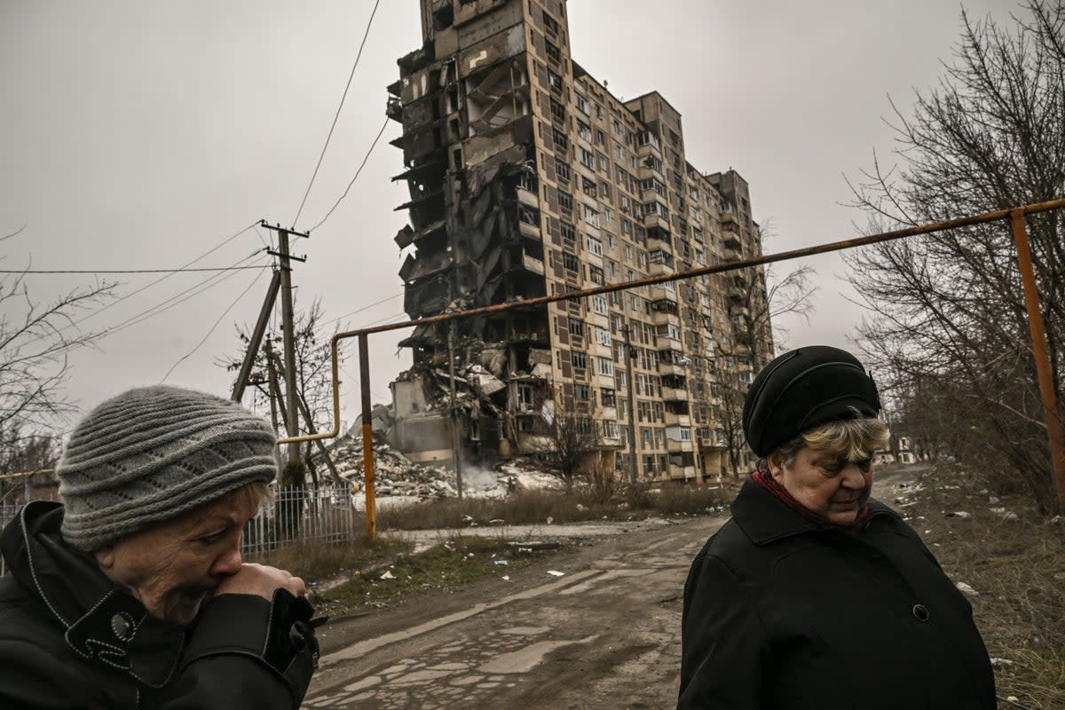Two eldery women stand in front of a destroyed apartment building after a strike, in the city of Avdiivka, Donetsk (AFP/Getty)