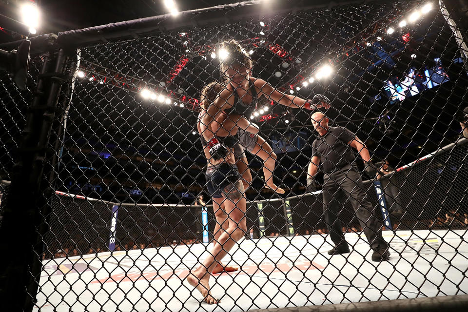 Tatiana Suarez (L) picks up Carla Esparza in the Women’s Strawweight bout during UFC 228 at American Airlines Center on Sept. 8, 2018 in Dallas, United States. (Getty Images)