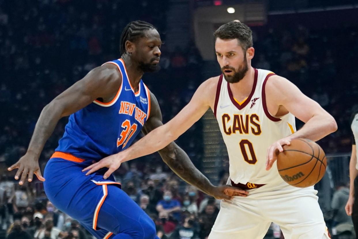 Cavaliers forward Kevin Love (0) drives against New York Knicks forward Julius Randle (30) in the first half of the Cavs' 95-93 win Monday night in Cleveland. [Tony Dejak/Associated Press]
