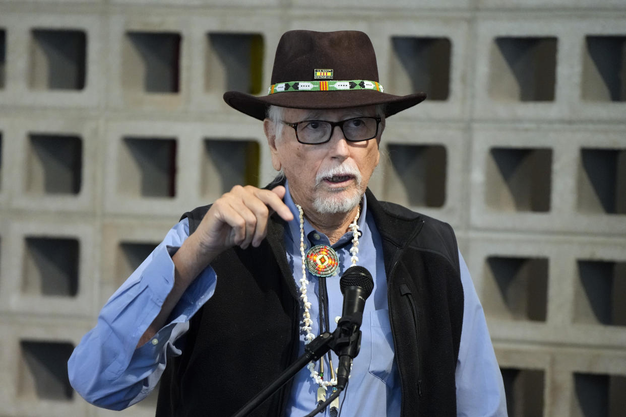 Dr. James Riding In speaks during a news conference by Native American advocacy groups, Thursday, Feb. 9, 2023, in Phoenix. The groups are calling for the NFL football team Kansas City Chiefs to drop their name, logo and their trademark “war chant” where fans make a chopping-hand gesture mimicking the Native American tomahawk. They play to demonstrate outside State Farm Stadium in the Phoenix suburb of Glendale during the Super Bowl 57 NFL football game. (AP Photo/Rick Scuteri)