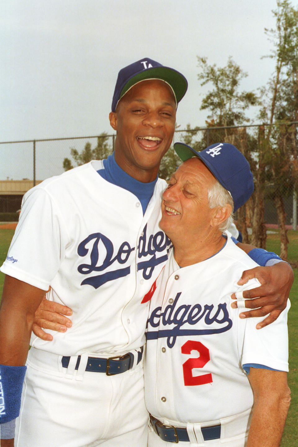 Los Angeles Dodgers manager Tommy Lasorda gives a team welcome to outfielder Darryl Strawberry during spring training at Dodgertown in Vero Beach, Fla., Wednesday morning, Feb. 27, 1991. (AP Photo/Richard Drew)