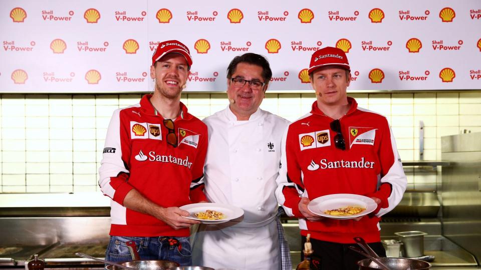 sebastian vettel and kimi raikkonen of ferrari meet chef guy grossi