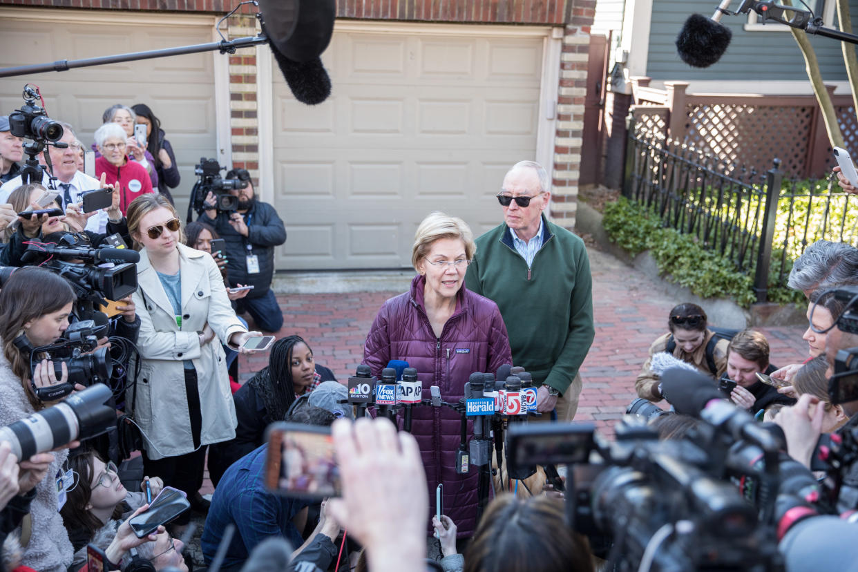 CAMBRIDGE, MA - MARCH 05:  Democratic presidential candidate Sen. Elizabeth Warren (D-MA), with husband Bruce Mann, announces that she is dropping out of the presidential race during a media availability outside of her home on March 5, 2020 in Cambridge, Massachusetts.  (Photo by Scott Eisen/Getty Images)