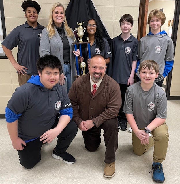 Gadsden Middle School's eighth-grade Scholars Bowl team won Alabama Middle School Division I state tournament held Feb. 24 at Hoover High School. Standing, from left, are Grey Stephens, sponsor Sue Bliss, Latika Prasadh, Colt Enders and Lowndes Robinson. Kneeling, from left, are Andrew Nguyen, coach Roy Bliss and Noah Sherrouse (a member of the elementary team).