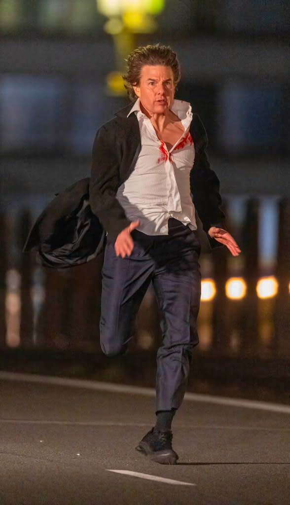 Tom Cruise races across Westminster Bridge into the Whitehall area of central London. Click News and Media/MEGA/SplashNews.com