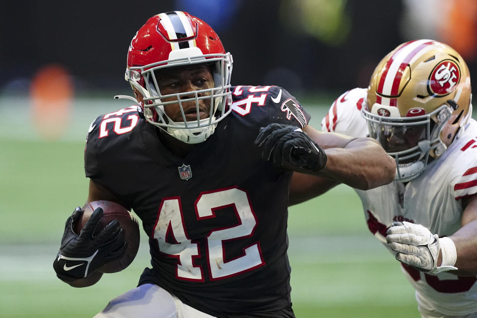 Atlanta Falcons running back Caleb Huntley (42) runs against the San Francisco 49ers during the first half of an NFL football game, Sunday, Oct. 16, 2022, in Atlanta. (AP Photo/John Bazemore)