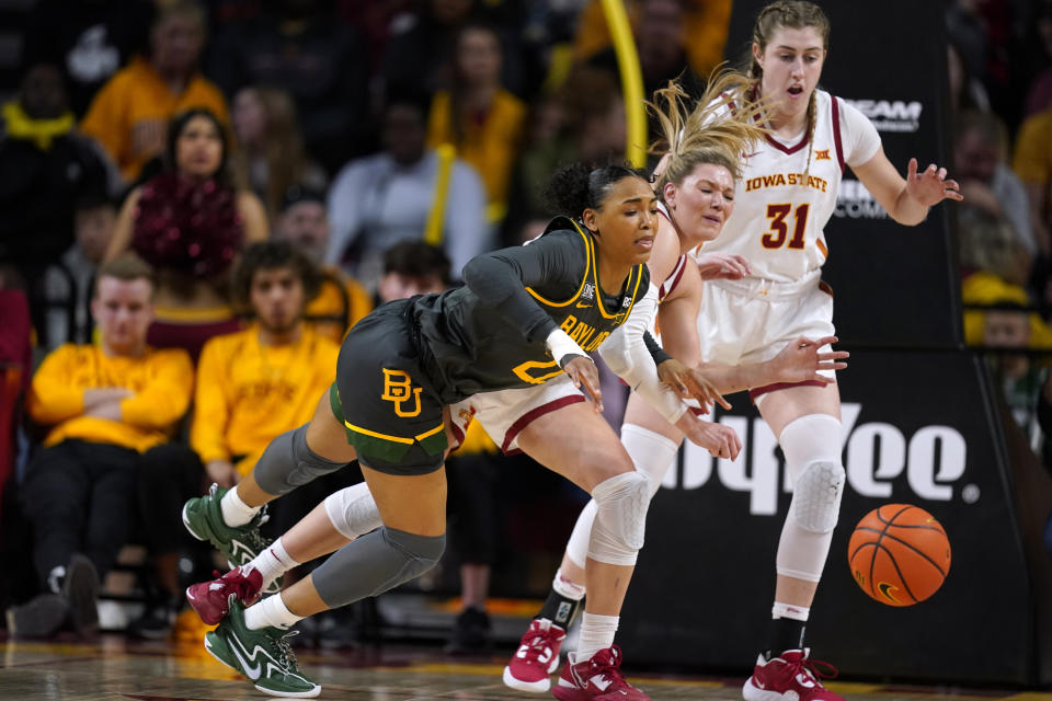 Baylor guard Bella Fontleroy, left, fights for a loose ball with Iowa State guard Ashley Joens, center, and forward Morgan Kane (31) during the first half of an NCAA college basketball game, Saturday, Feb. 4, 2023, in Ames, Iowa. (AP Photo/Charlie Neibergall)
