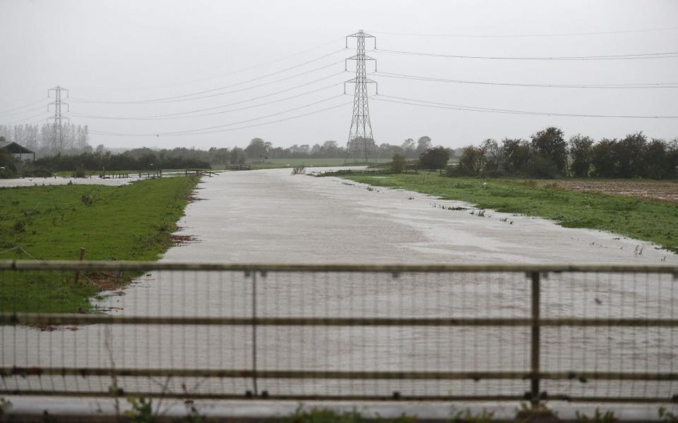 A flooded River Brue near to Westhay in Somerset. The UK's wet weekend will continue as a weather warning for rain across parts of Wales and England has been extended - Andrew Matthews/PA