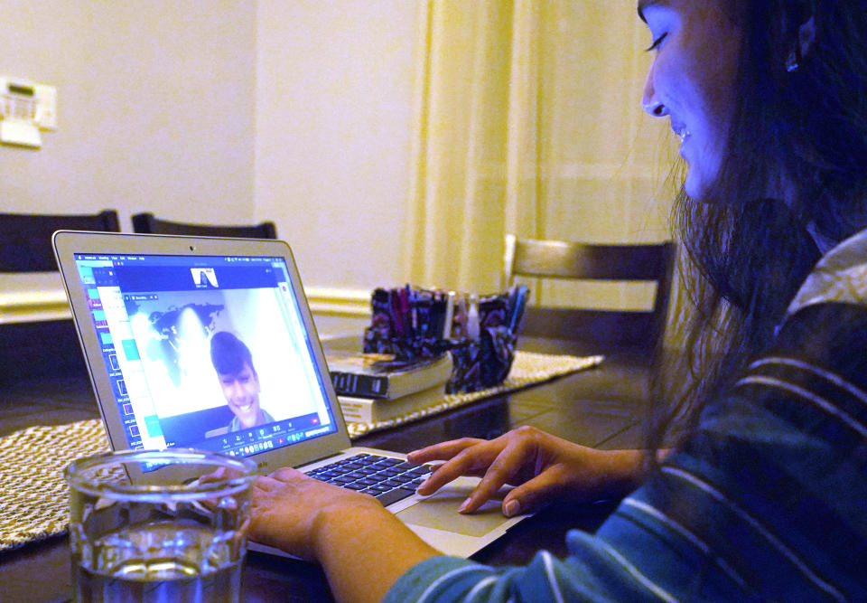 Charvi Goyal, 17, gives an online math tutoring session to a junior high student Monday, Jan. 4, 2021, in Plano, Texas. Goyal is part of a group of high school students that put together their own volunteer online tutoring service to help k-12 during the pandemic. (AP Photo/LM Otero)