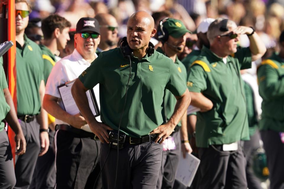 Baylor coach Dave Aranda talks to an official standing nearby.