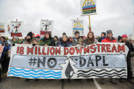 Protesters block highway 1806 in Mandan during a protest against plans to pass the Dakota Access pipeline near the Standing Rock Indian Reservation, North Dakota, U.S. November 23, 2016. REUTERS/Stephanie Keith