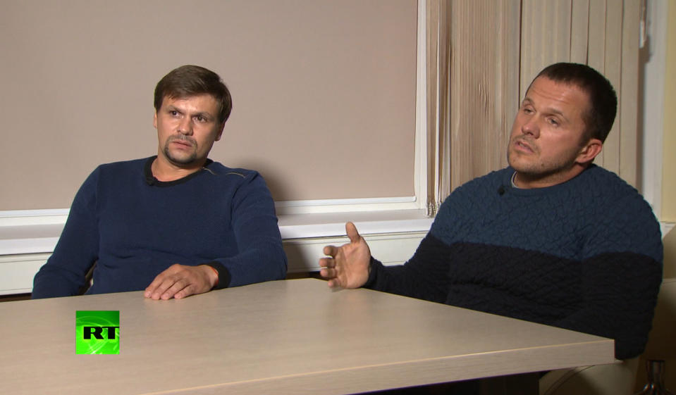 FILE - In this video grab provided by the RT channel on Thursday, Sept. 13, 2018, Ruslan Boshirov, left, and Alexander Petrov attend their first public appearance in an interview with the RT channel in Moscow, Russia. The investigative group Bellingcat says it has identified one of the two suspects in the poisoning of an ex-Russian spy as a highly-decorated colonel of the Russian military intelligence agency GRU. Bellingcat said Wednesday, Sept. 26 that the suspect whose passport name was Ruslan Boshirov is in fact Col. Anatoliy Chepiga. (RT channel video via AP)