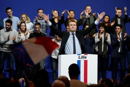 Emmanuel Macron, head of the political movement En Marche !, or Forward !, and candidate for the 2017 French presidential election, sings the French national anthem at the end of a political rally in Lille, France January 14, 2017. REUTERS/Pascal Rossignol