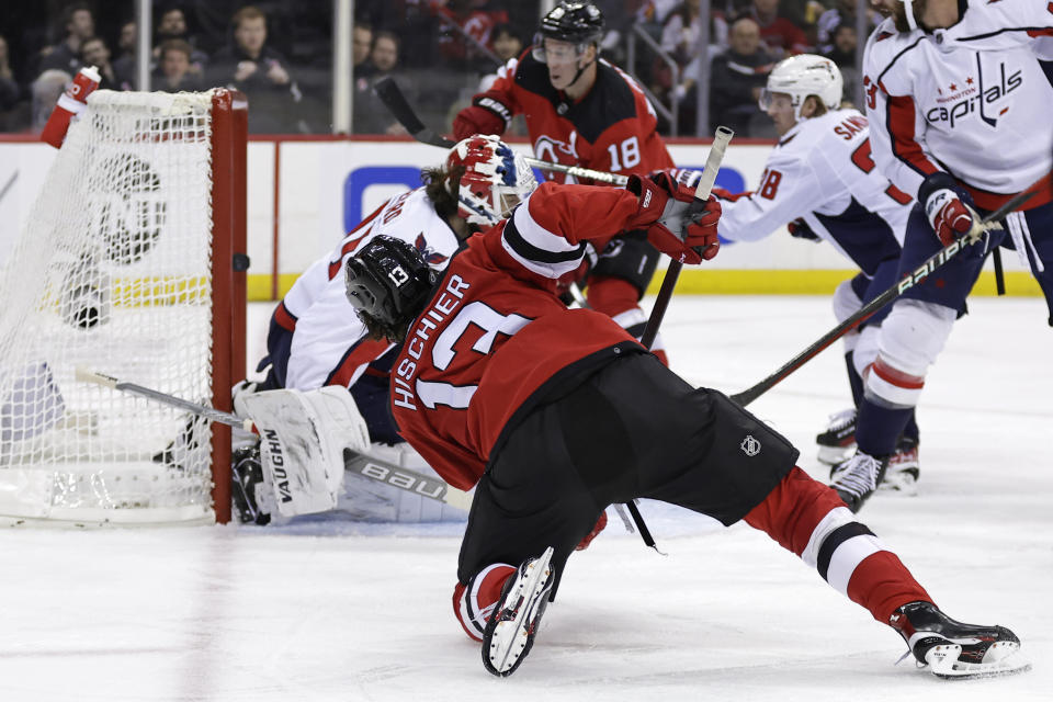 New Jersey Devils center Nico Hischier (13) scores a goal past Washington Capitals goaltender Hunter Shepard during the second period of an NHL hockey game Wednesday, Oct. 25, 2023, in Newark, N.J. (AP Photo/Adam Hunger)