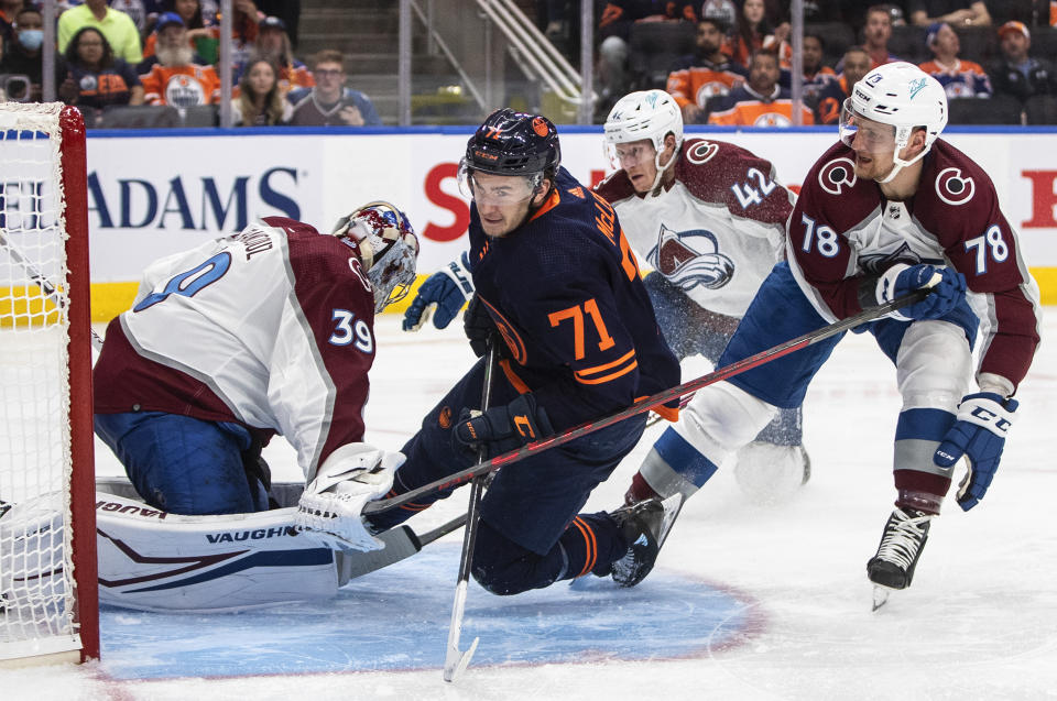 Colorado Avalanche goalie Pavel Francouz (39) is crashed into by Edmonton Oilers' Ryan McLeod (71) as Avalanche center Nico Sturm (78) defends during the second period of Game 3 of the NHL hockey Stanley Cup playoffs Western Conference finals, Saturday, June 4, 2022, in Edmonton, Alberta. (Jason Franson/The Canadian Press via AP)