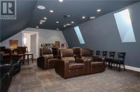 <p><span>57 Clear View Rd., Grand Barachois, N.B.</span><br> The home also has some great dedicated-purpose rooms, like this home theatre, as well as a wine cellar.<br> (Photo: Zoocasa) </p>