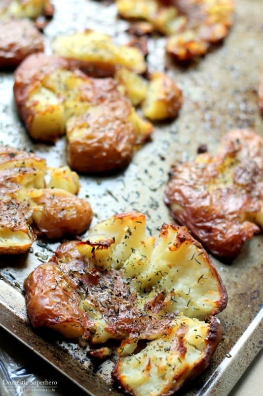 <p>Domestic Superhero</p><p>Smothered in tasty herbs and chunky salt, these salt-herbed smashed red potatoes are finger-lickin’ good!</p><p><strong>Get the recipe: <a href="https://domesticsuperhero.com/best-ever-salty-herbed-smashed-red-potatoes/" rel="nofollow noopener" target="_blank" data-ylk="slk:Salty Herbed Smashed Red Potatoes;elm:context_link;itc:0;sec:content-canvas" class="link rapid-noclick-resp">Salty Herbed Smashed Red Potatoes</a></strong></p>