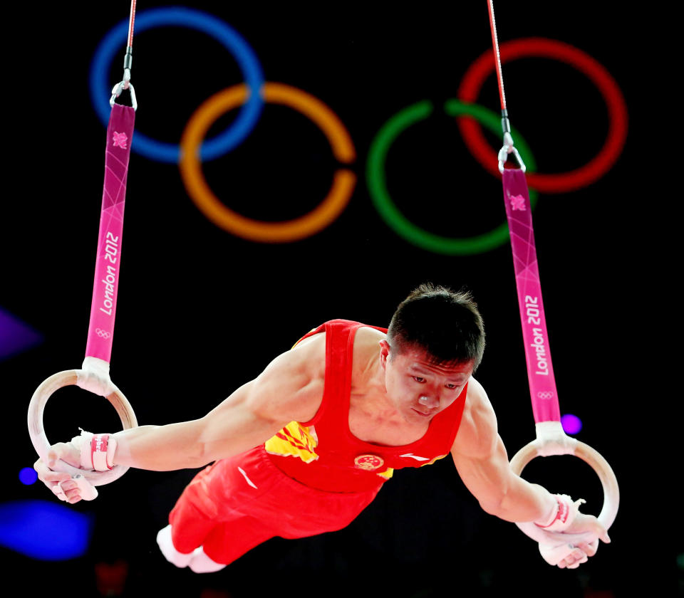 Yibing Chen of China competes in the rings in the Artistic Gymnastics Men's Team final on Day 3 of the London 2012 Olympic Games at North Greenwich Arena on July 30, 2012 in London, England. (Photo by Ronald Martinez/Getty Images)