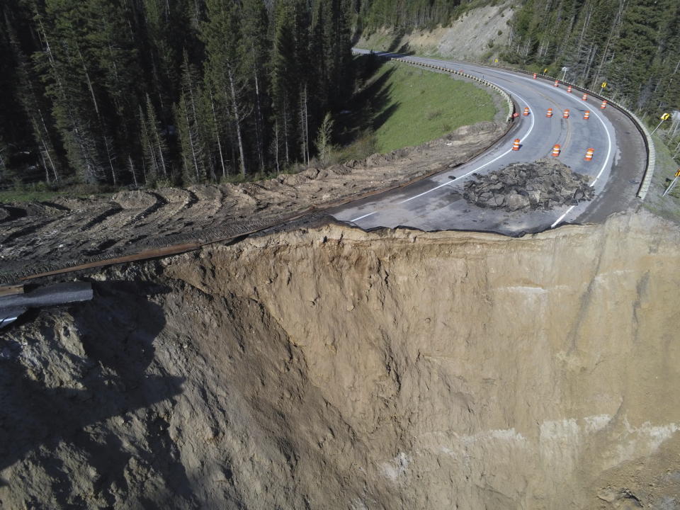 This photo provided by Wyoming Highway Patrol shows a damaged section of Teton Pass near Jackson, Wyo., on Saturday, June 8, 2024, that officials said had “catastrophically failed.” (Wyoming Highway Patrol via AP)