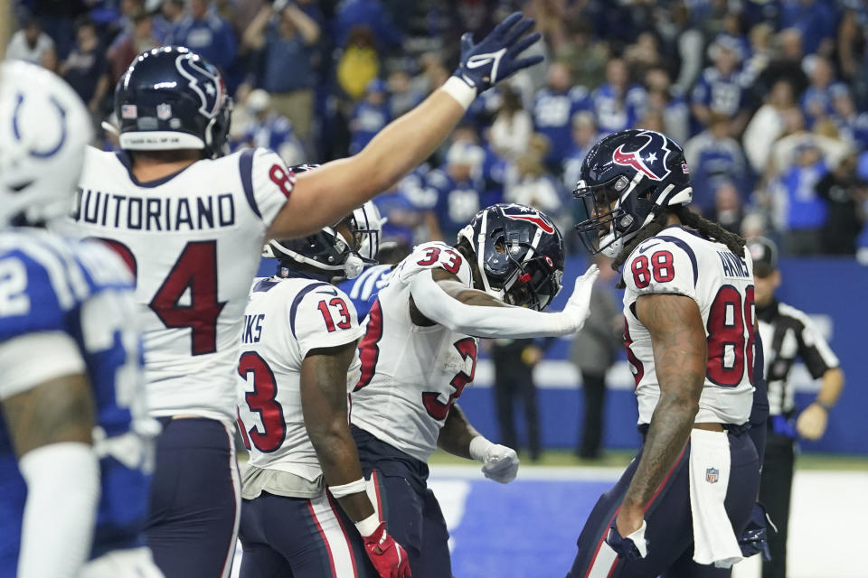 Houston Texans tight end Jordan Akins (88) is congratulated after scoring a two-point conversion during the second half of an NFL football game between the Houston Texans and Indianapolis Colts, Sunday, Jan. 8, 2023, in Indianapolis. (AP Photo/Darron Cummings)