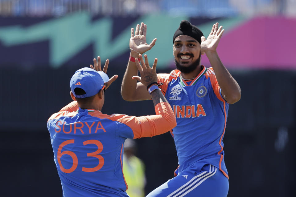 India's Arshdeep Singh, right, celebrates with teammate Suryakumar Yadav after the dismissal of United States' Shayan Jahangir during the ICC Men's T20 World Cup cricket match between United States and India at the Nassau County International Cricket Stadium in Westbury, New York, Wednesday, June 12, 2024. (AP Photo/Adam Hunger)