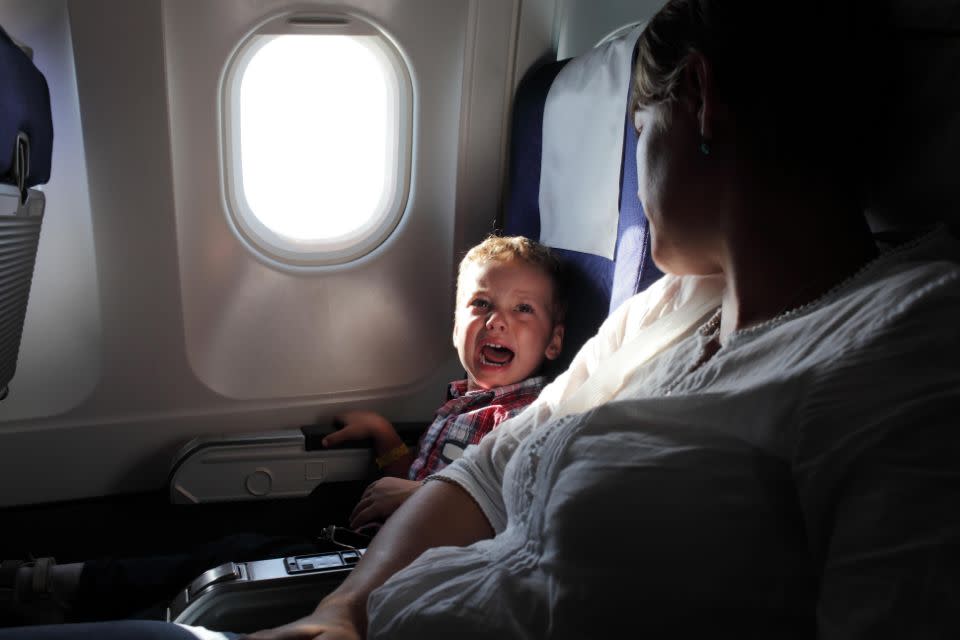 It takes kids 49 minutes to get bored on a flight. Photo: Getty Images