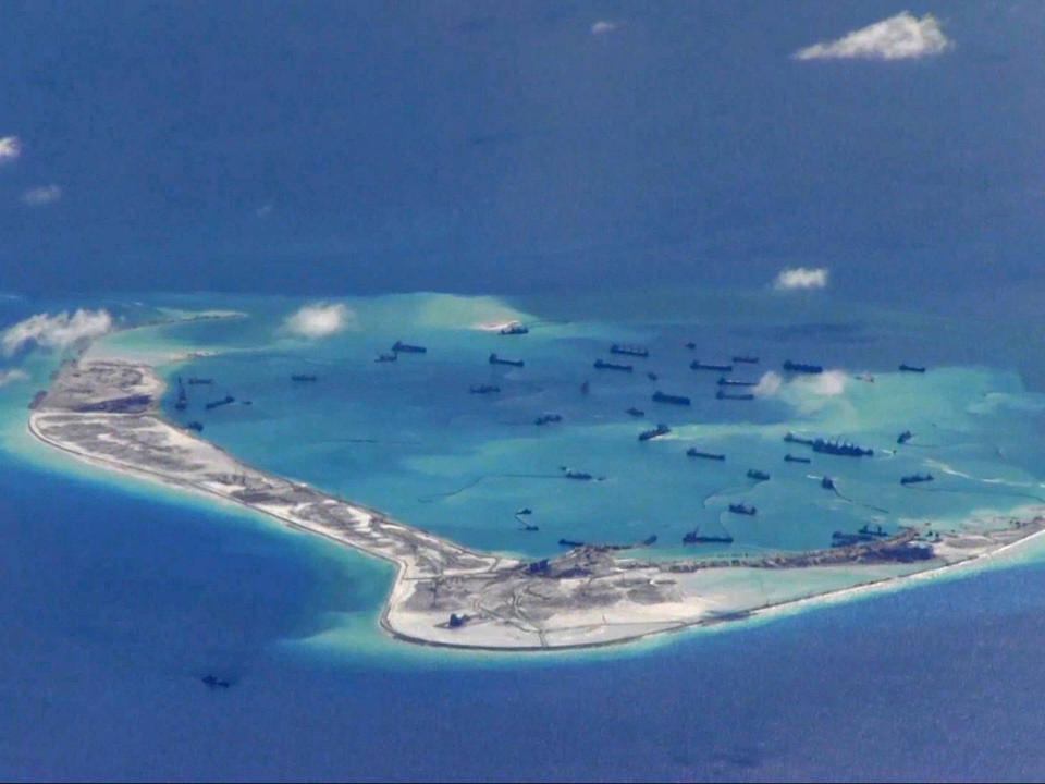 Chinese dredging vessels are purportedly seen in the waters around Mischief Reef in the disputed Spratly Islands in the South China Sea: US Navy