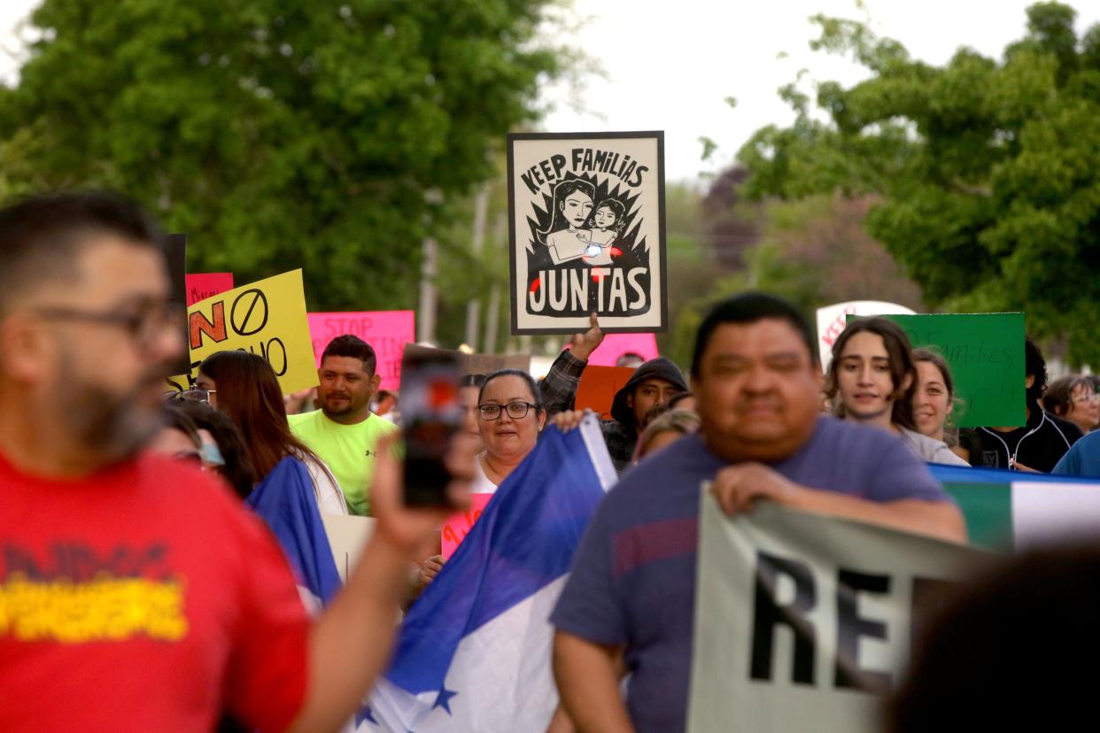 Members of Escucha Mi Voz march along Iowa Avenue while protesting a new state immigration law Wednesday, May 1, 2024 in Iowa City, Iowa.