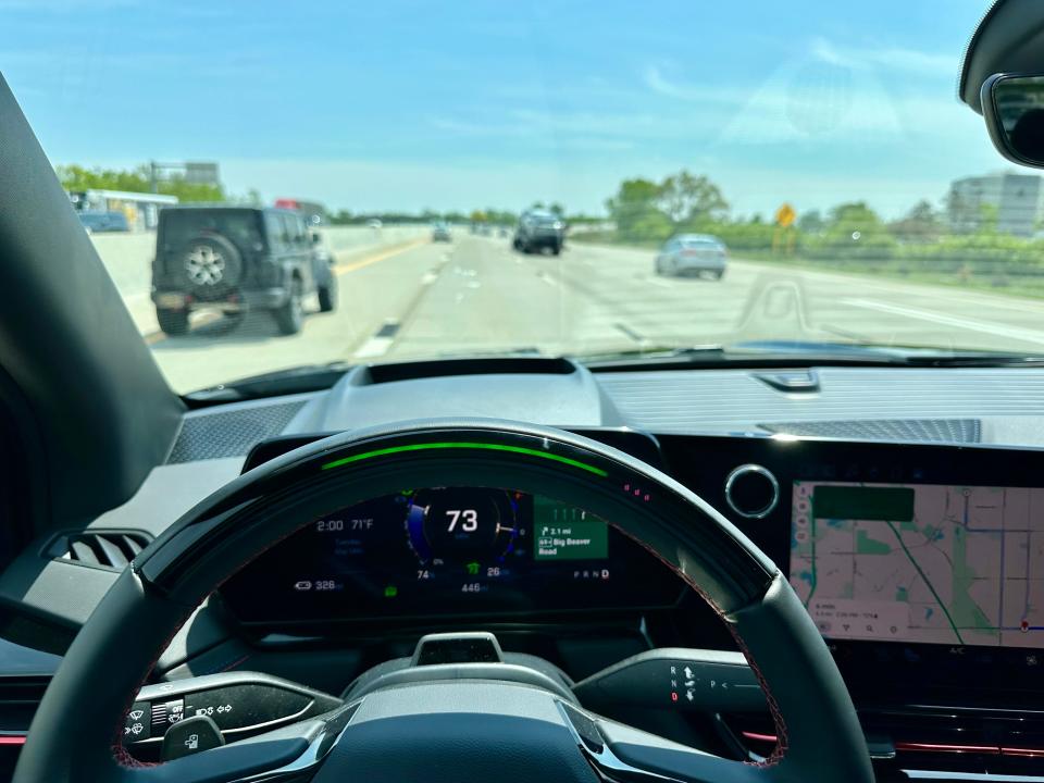 My view behind the wheel of a Silverado EV driving I-75 for me with SuperCruise