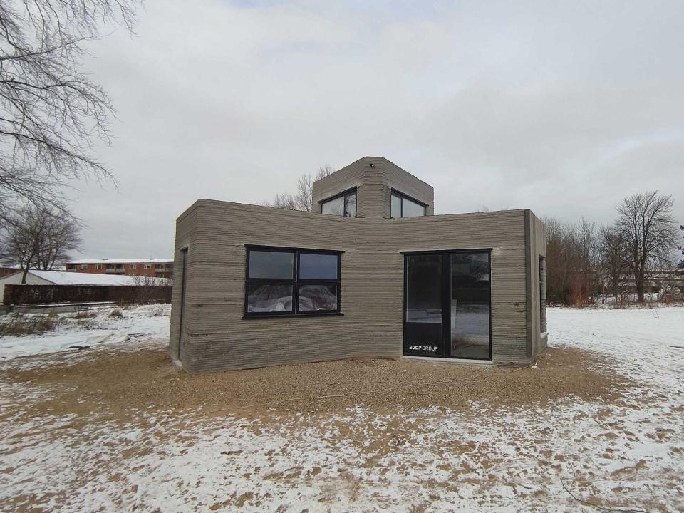 The 3D printed home in the snow.