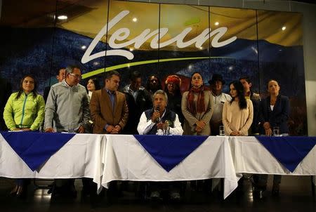 Lenin Moreno (C), presidential candidate of the ruling PAIS Alliance Party, gives a news conference accompanied by candidates for Ecuador's Assembly in Quito, Ecuador, February 20, 2017. REUTERS/Mariana Bazo