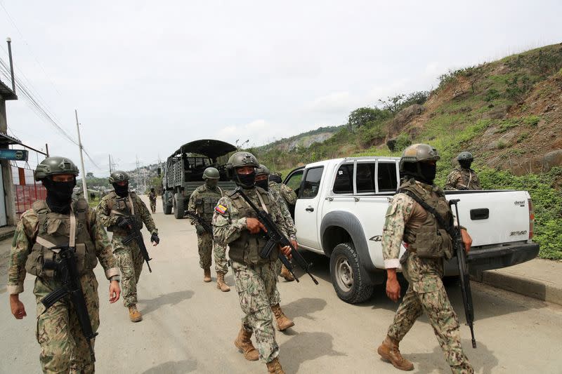 Members of Security Forces check an area near the Zonal 8 prison, from where Jose Adolfo Macias alias "Fito" disappeared earlier in the month, in Guayaquil