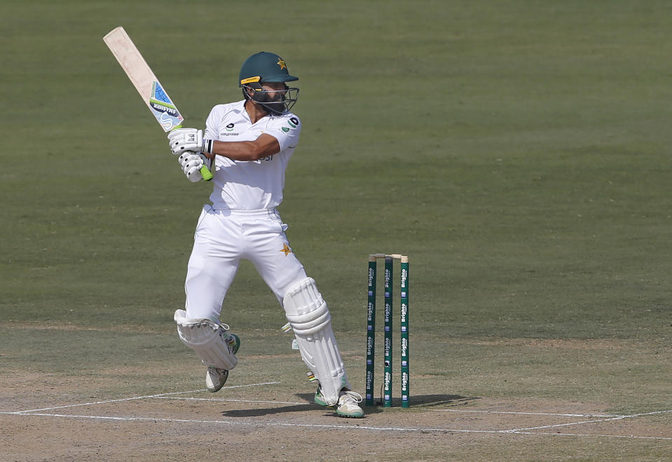 Pakistan's batsman Fawad Alam follows the ball after playing a shot for boundary during the second day of the first cricket test match between Pakistan and South Africa at the National Stadium, in Karachi, Pakistan, Wednesday, Jan. 27, 2021. (AP Photo/Anjum Naveed)