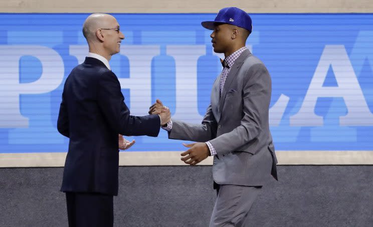 NBA commissioner Adam Silver congratulates Markelle Fultz on being drafted first. (AP)