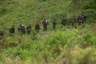 <p>Member of the 51st Front of the Revolutionary Armed Forces of Colombia (FARC) patrol in the remote mountains of Colombia, August 16, 2016. (John Vizcaino/Reuters) </p>