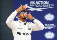 Britain Formula One - F1 - British Grand Prix 2016 - Silverstone, England - 9/7/16 Mercedes' Lewis Hamilton celebrates qualifying in pole position Reuters / Matthew Childs Livepic