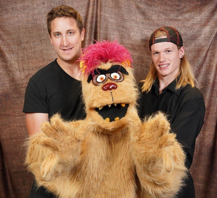 “Avenue Q” puppet, Trekkie Monster, is so big, he requires two actors to operate him. Pictured are ACTORS cast members Jeffrey Makinster and Jason Prazak as Trekkie Monster.