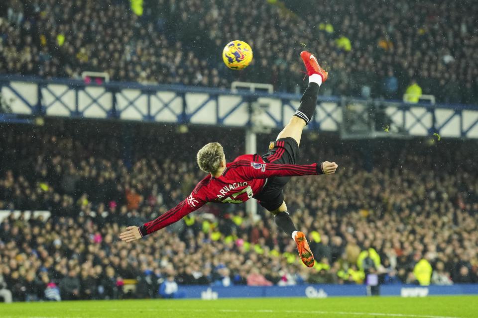 Manchester United's Alejandro Garnacho scores his first goal during the English Premier League soccer match between Everton and Manchester United, at Goodison Park Stadium, in Liverpool, England, Sunday, Nov. 26, 2023. (AP Photo/Jon Super)