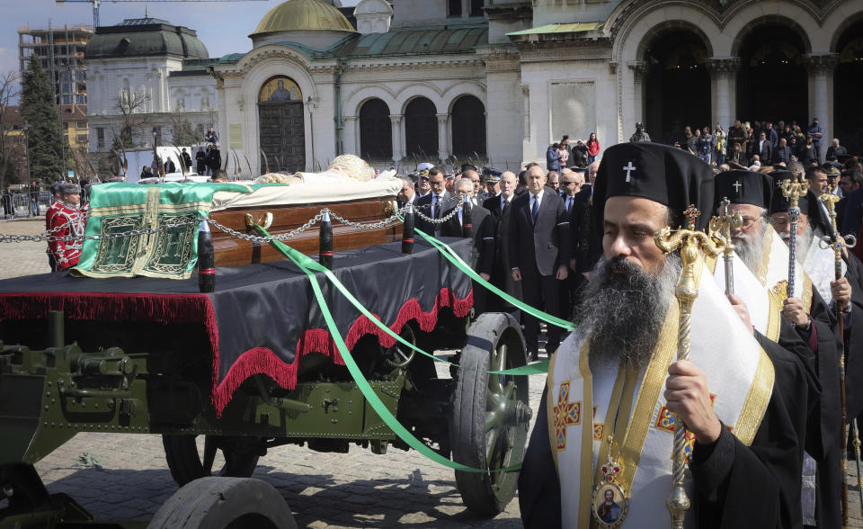 Bulgarian Orthodox clergy walk beside the coffin of Bulgarian Patriarch Neophyte during his funeral with honours procession in front of the Alexander Nevsky Cathedral, in Sofia, Saturday, March 16, 2024. Bulgarians have lined the streets of Sofia to bid farewell to the late Orthodox Patriarch Neophyte. The spiritual leader of Bulgaria’s Orthodox Christians died on Wednesday at the age of 78 after a long illness. Neophyte, who became patriarch in 2013, was the first elected head of the Bulgarian church after the fall of communism in 1989. (AP Photo/Valentina Petrova)