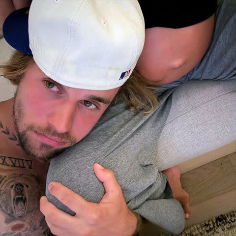 <p>Justin Bieber/Instagram</p> Justin posted a photo of him cuddling his wife Hailey's bare baby bump on July 26