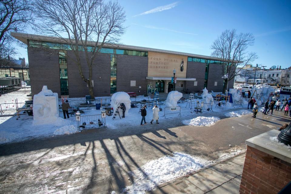An overall of the snow carving area at the Fond du Lac Public library, Saturday, February 11, 2023, in Fond du Lac, Wis.