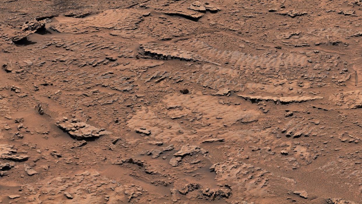  The bumpy texture of these rocks is the clearest evidence yet from Mount Sharp of an ancient Martian lake. Billions of years ago, wind playing across the surface of a shallow lake disturbed the lake-bottom sediments, which eventually became these rocks. 