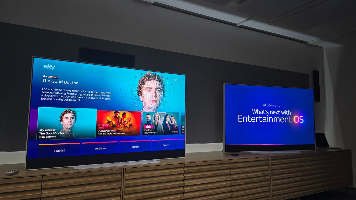  Two Sky Glass TVs on a wooden unit. 