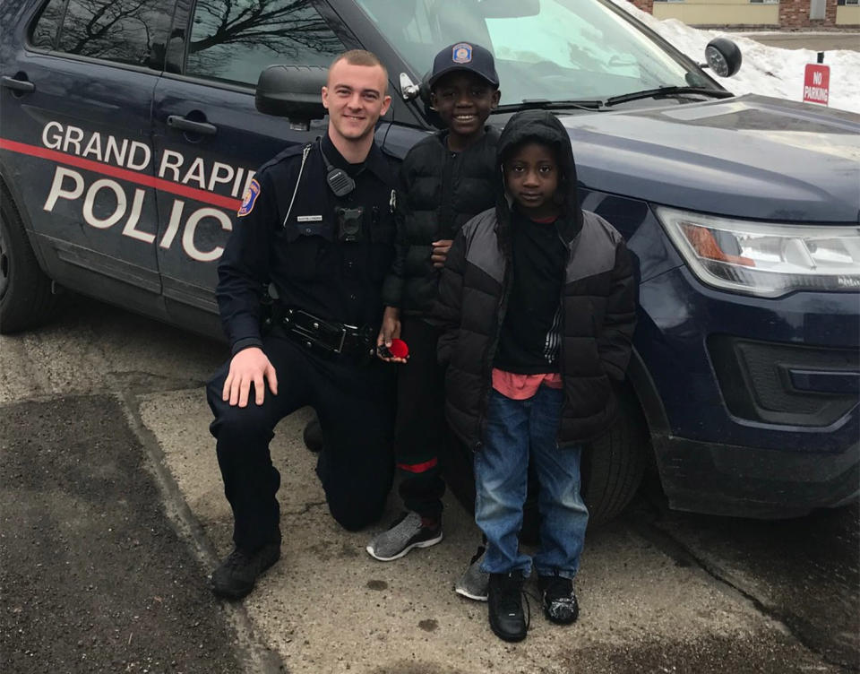 Officer Austin Lynema learned it was Thomas Daniel’s birthday when he gave the boy a lift to school when he missed his bus. Source: Grand Rapids Police Department/Facebook