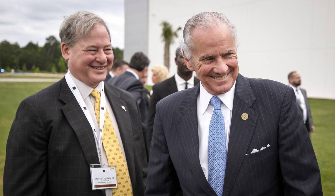 S.C. Commerce Sec. Harry Lightsey, left, and S.C. Gov. Henry McMaster share a laugh during the Mark Anthony Brewing grand opening and ribbon cutting event in Columbia, S.C. on Thursday, May 12, 2022. (Photo by Travis Bell/STATEHOUSE CAROLINA)